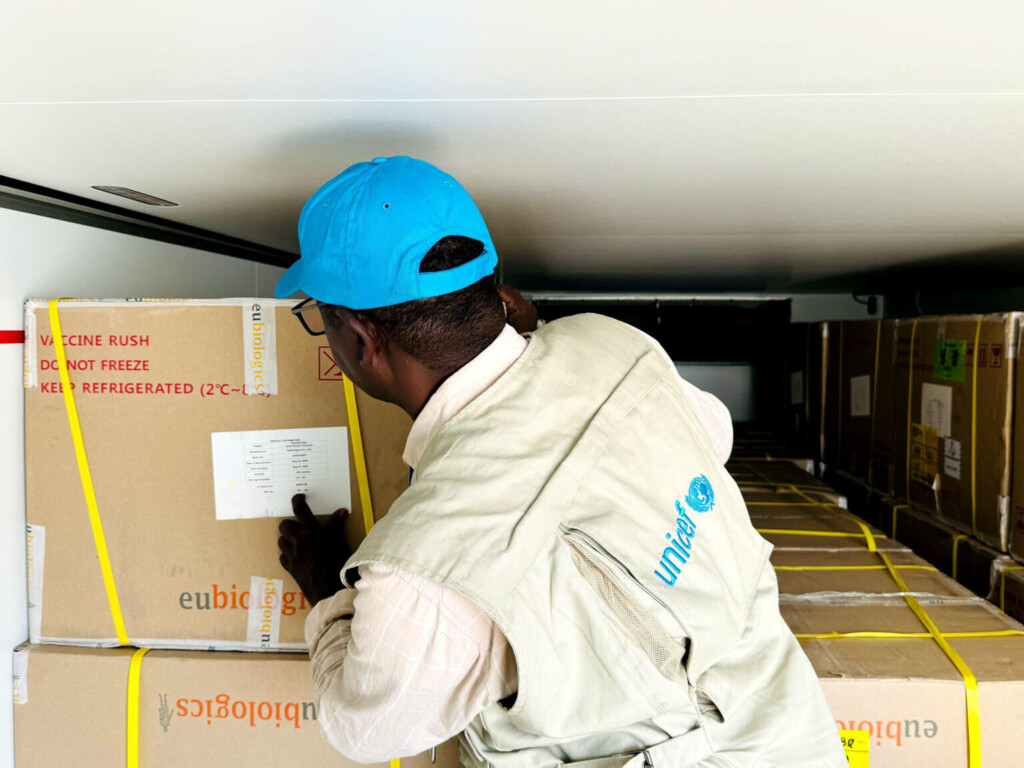 On 5 October 2024 in Port Sudan, Sudan, UNICEF Health Officer Khattab Obaid inspects a shipment of cholera vaccines in the back of a refrigerated truck before they are transported to Kassala, Gedaref and River Nile states. A UNICEF-chartered plane carrying 1.4 million doses of oral cholera vaccines arrived in Port Sudan, Sudan, early this morning, to bolster efforts to protect children from the ongoing cholera outbreak affecting the country. Since the current outbreak began in July 2024, over 18,000 cases of cholera and approximately 550 deaths have been reported in 10 states across the country. The new batch of vaccines adds to the 404,000 doses UNICEF delivered to Sudan last month and will be used in the ongoing immunization campaigns. The campaigns aim to vaccinate 1.81 million people against cholera in the hardest-hit states: Gedaref, Kassala and River Nile. Besides cholera, concurrent outbreaks of other diseases – such as dengue, malaria and measles – are taking hold in at least 12 of Sudan’s 18 states. Earlier this week, UNICEF delivered nearly 190,000 doses of malaria vaccines to the country to help protect children from malaria. “Coming on the heels of war, displacement and famine, the impact of these epidemics could be catastrophic for children,” said Sheldon Yett, UNICEF Representative to Sudan. “Delivery of the vaccines to health authorities in Sudan and into the arms of communities most at risk is essential for stopping the spread of these deadly diseases.” Ongoing disease outbreaks are pushing Sudan’s already fragile healthcare system to a breaking point and exacerbating weaknesses in the sanitation and hygiene infrastructure. Limited access to safe water and adequate sanitation, especially in overcrowded displacement sites and camps increases the risk of transmission. Children who have never been vaccinated and those suffering from malnutrition are particularly at risk. “We need all hands on deck now to scale up our response,